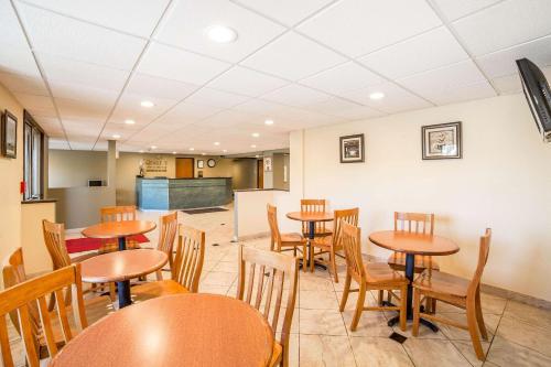a dining room with wooden tables and chairs at Quality Inn & Suites Elko in Elko