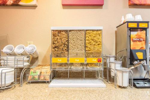a store with a shelf of food and a vending machine at Comfort Suites Rochester Henrietta University Area in Henrietta