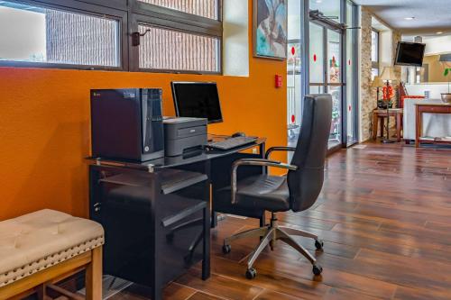 an office with a desk with a computer and a chair at Quality Inn Schenectady - Albany in Schenectady