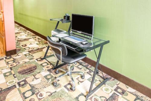 a desk with a laptop computer on top of it at Quality Inn & Suites Columbus West - Hilliard in Columbus