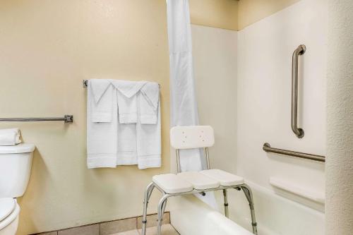 a bathroom with a toilet and a towel rack at Quality Inn in Gallipolis