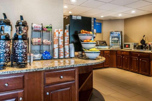 a kitchen with a counter with bowls of fruit on it at Comfort Inn in Pickerington