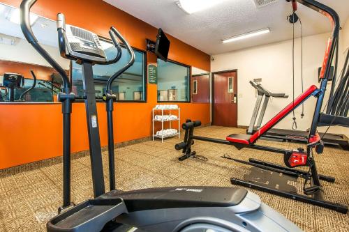 a gym with several tread machines in a room at Comfort Inn in Pickerington