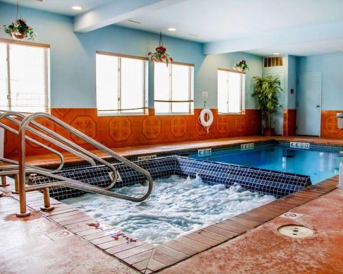 a swimming pool with a water slide in the middle at Sleep Inn & Suites Oklahoma City Northwest in Oklahoma City