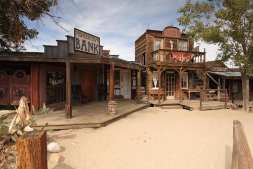 a wooden building with a sign that readsederal bank at Casa Cueva Calatrava in Tabernas