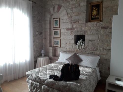 Postel nebo postele na pokoji v ubytování Suite Assisi
