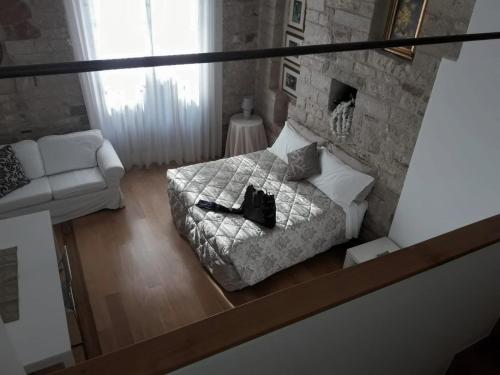 Postel nebo postele na pokoji v ubytování Suite Assisi