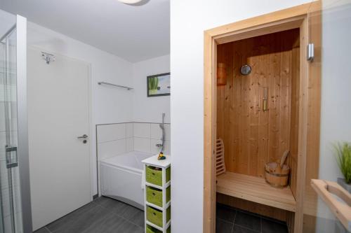 a small bathroom with a shower and a toilet at Kluntje in Olpenitz
