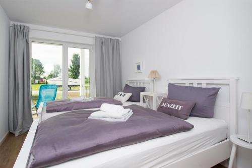 מיטה או מיטות בחדר ב-Blaue Ferne