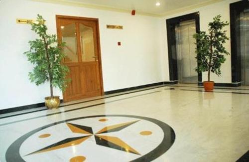 a large room with a clock on the floor at HOTEL UDUPI INTERNATIONAL in Nāgercoil