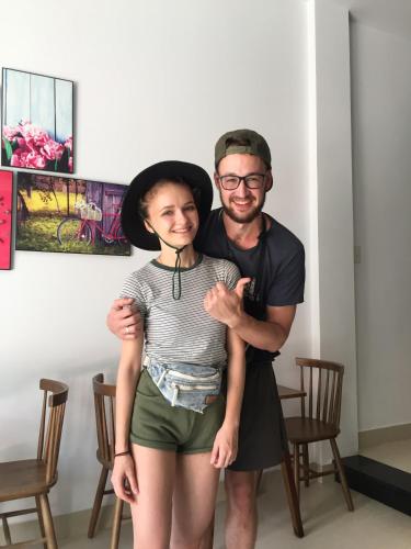a man and a woman posing for a picture at candyinn in Hue