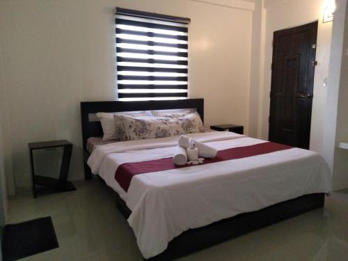 Una cama o camas en una habitación de DaHome Pension