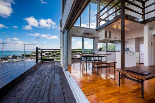 a kitchen and dining room with a view of the ocean at E-horizon Resort Condominium Yomitan in Yomitan