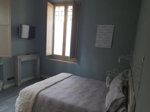 Ένα ή περισσότερα κρεβάτια σε δωμάτιο στο L'Ortodellerose