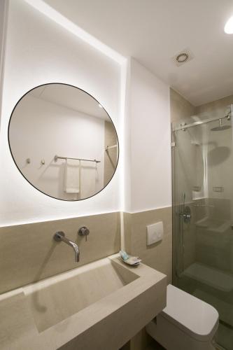 a bathroom with a sink and a mirror at Destil B&B in Tirana
