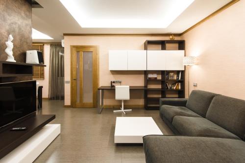 a living room with a couch and a table at Apartment 13А Holosiivska Street in Kyiv