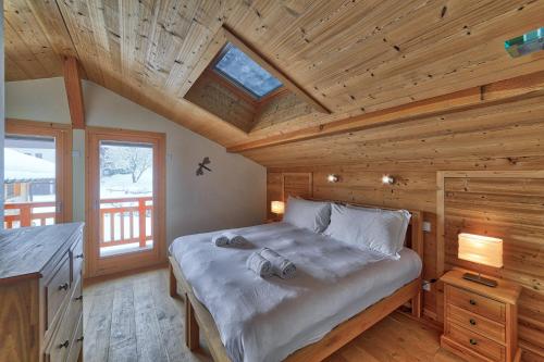Tempat tidur dalam kamar di Chalet Lynx