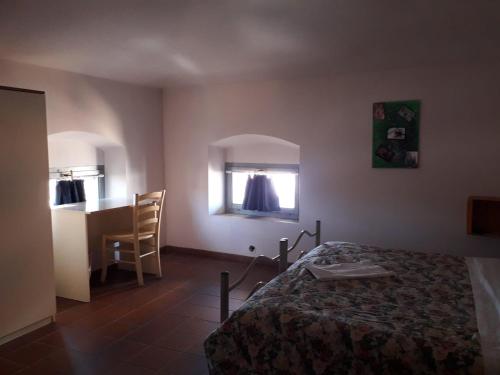 Katil atau katil-katil dalam bilik di Ostello Palazzo Pierantoni