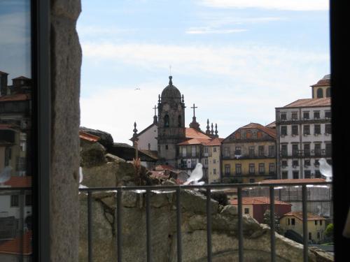 a view of a city from a window at Urban Apartment Casa da Portela in Porto