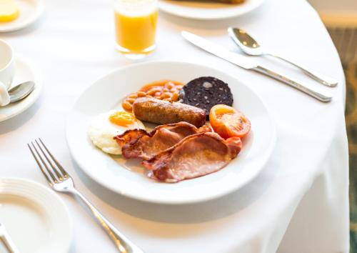 a plate of breakfast food on a table at The Imperial Torquay in Torquay