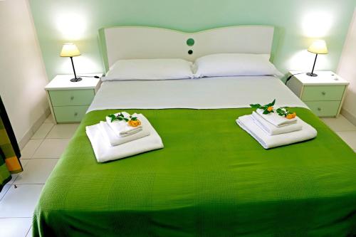 A bed or beds in a room at Portorosa Residence