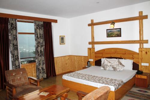 Krevet ili kreveti u jedinici u objektu Hotel Mountain Trail Manali
