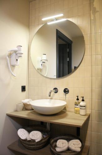 a bathroom with a sink and a mirror and towels at Villa360 in Amsterdam