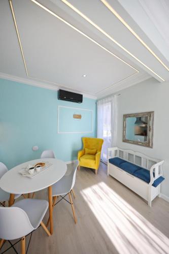 a bedroom with a bed and a table and chairs at Villa DOEL in Zadar