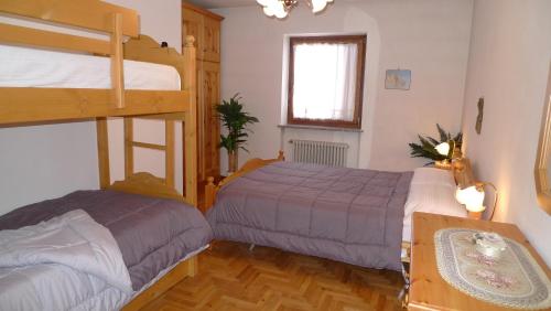 Postel nebo postele na pokoji v ubytování Condominio La Mont 2