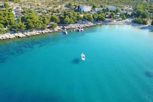 an aerial view of a boat in a large body of water at Mobile homes-Slanica in Murter