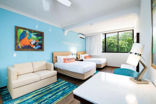 a large living room with a couch at Margaritaville Beach Resort Playa Flamingo in Playa Flamingo