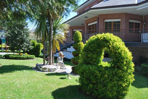 a house with a large number in the yard at El Jardin in Soto de la Marina