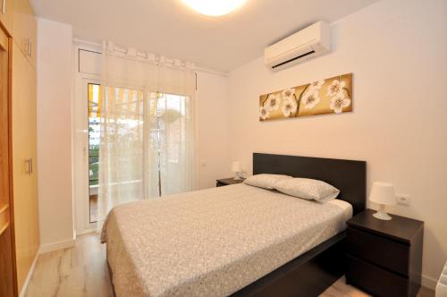 Tempat tidur dalam kamar di Apartment Bonsol