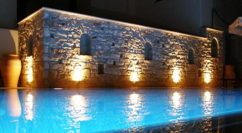 a stone building with lights on top of it at Anna Platanou Hotel in Parikia
