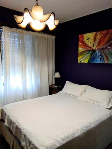 Una cama o camas en una habitación de Texas Verdes Alojamiento Familiar