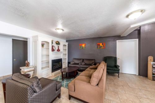 a living room with a couch and two chairs at Studio 6-San Antonio, TX - Fort Sam Houston Area in San Antonio