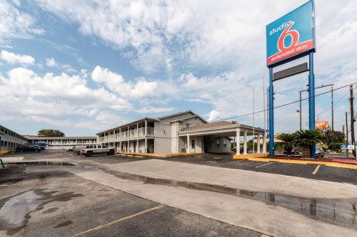 a gas station with a sign in a parking lot at Studio 6-San Antonio, TX - Fort Sam Houston Area in San Antonio