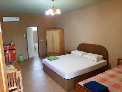 Ένα ή περισσότερα κρεβάτια σε δωμάτιο στο Baandin resort