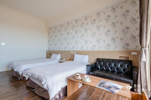 Postel nebo postele na pokoji v ubytování Taroko Inn