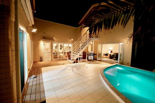 a large bathroom with a tub and a staircase at KIYAZA RESORT Kamakura in Kamakura