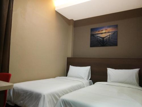 Postel nebo postele na pokoji v ubytování Asiago Hotel