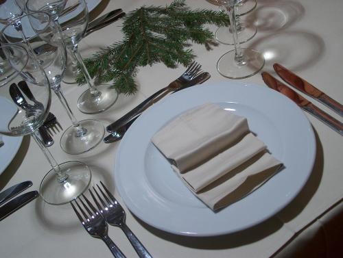 a white plate with a piece of cake on a table at Vila Jelena Zlatar Nova varoš in Brdo