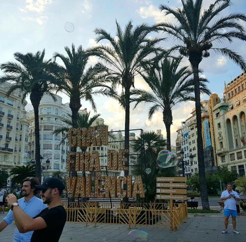 a group of men standing in front of a display with palm trees at Bianca in Valencia