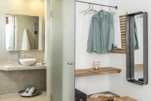 a bathroom with a sink and a mirror at Cocoon Suites in Imerovigli
