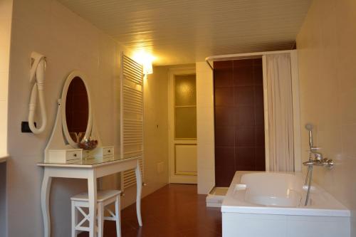 a bathroom with a white sink and a mirror at Artua'&Solferino in Turin