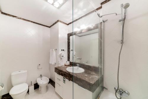 a bathroom with a shower and a toilet and a sink at Vila Formosa I by An Island Apart in Funchal
