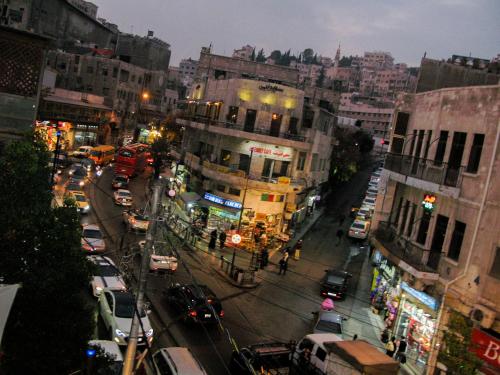 a view of a busy city street at night at Cliff Hostel in Amman