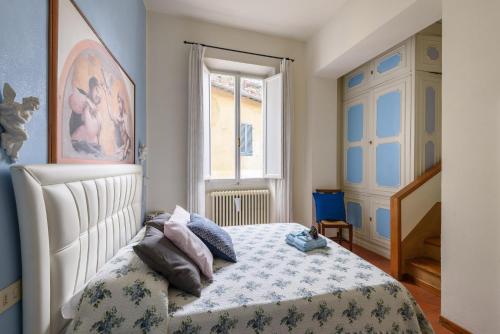 Ένα ή περισσότερα κρεβάτια σε δωμάτιο στο Enchanting Alcove in Florence Ponte Vecchio
