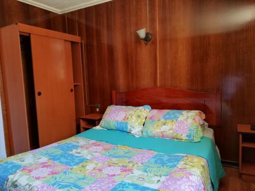 Postel nebo postele na pokoji v ubytování Hostal Dinamarca