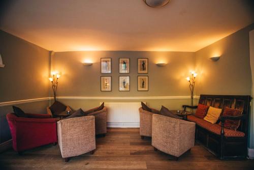 a living room filled with furniture and a couch at Tynycornel Hotel in Tal-y-llyn